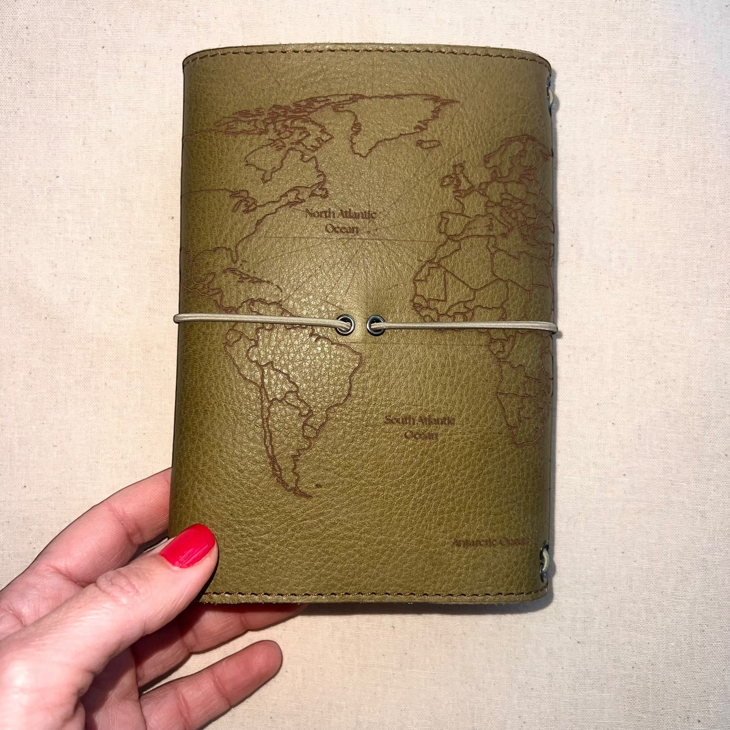 carnet de voyage en cuir vert