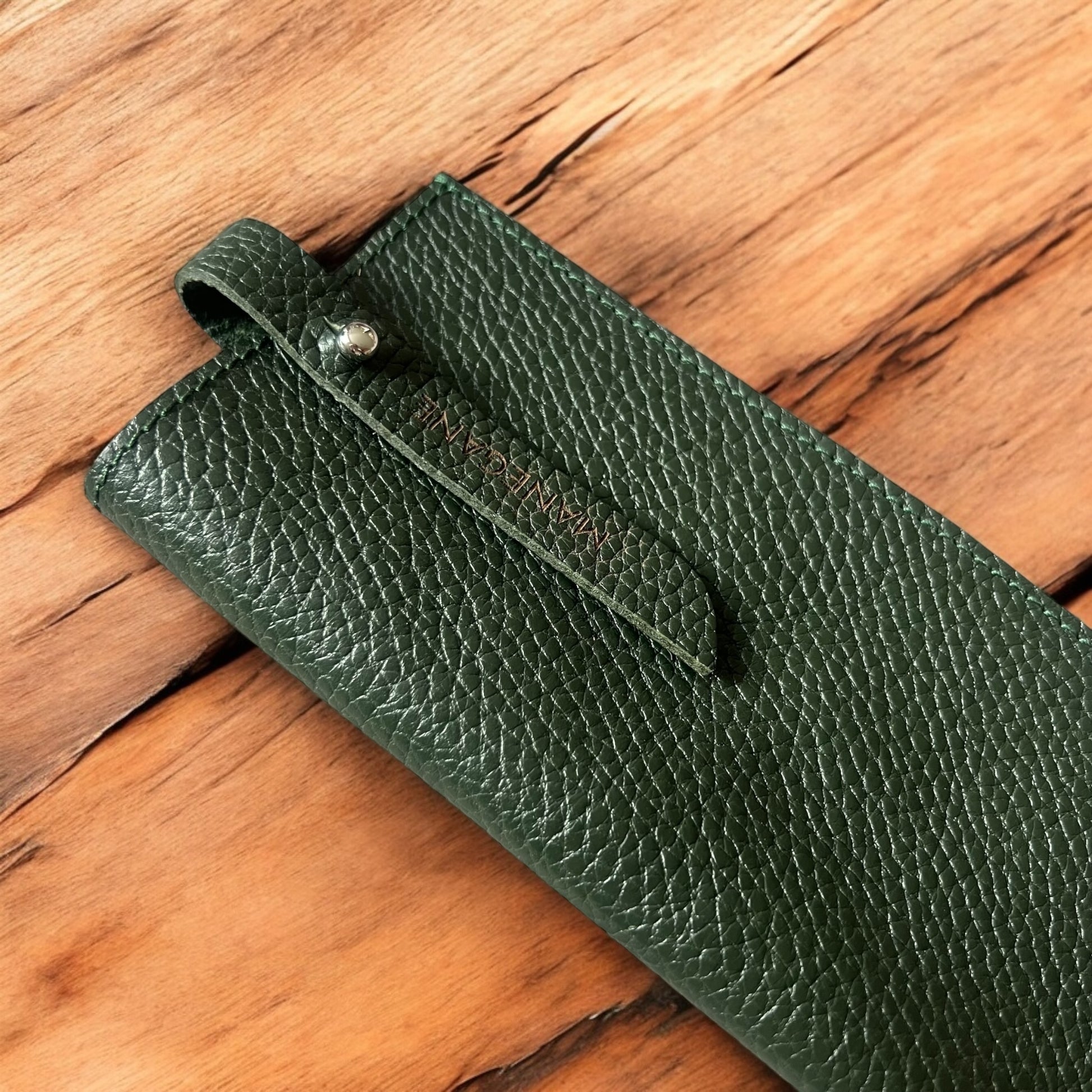 pochette à lunettes en cuir vert foncé